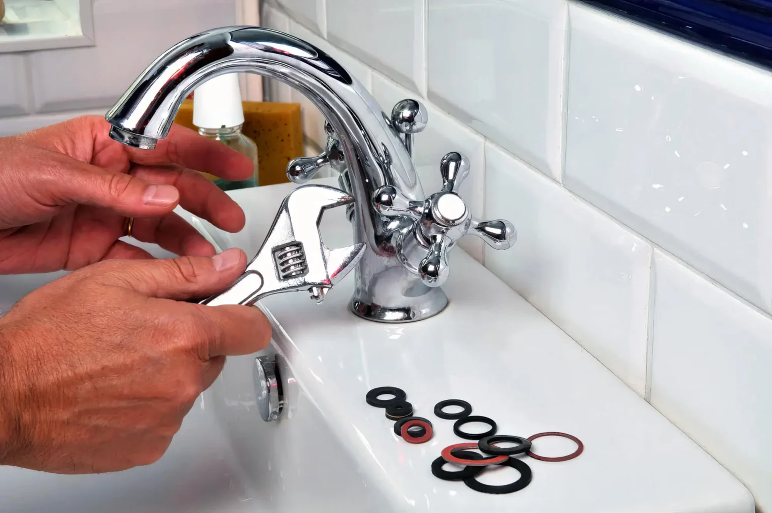 Plumber maintaining a bathroom faucet in El Monte