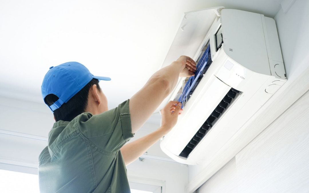 HVAC technician servicing a ductless mini split in El Monte