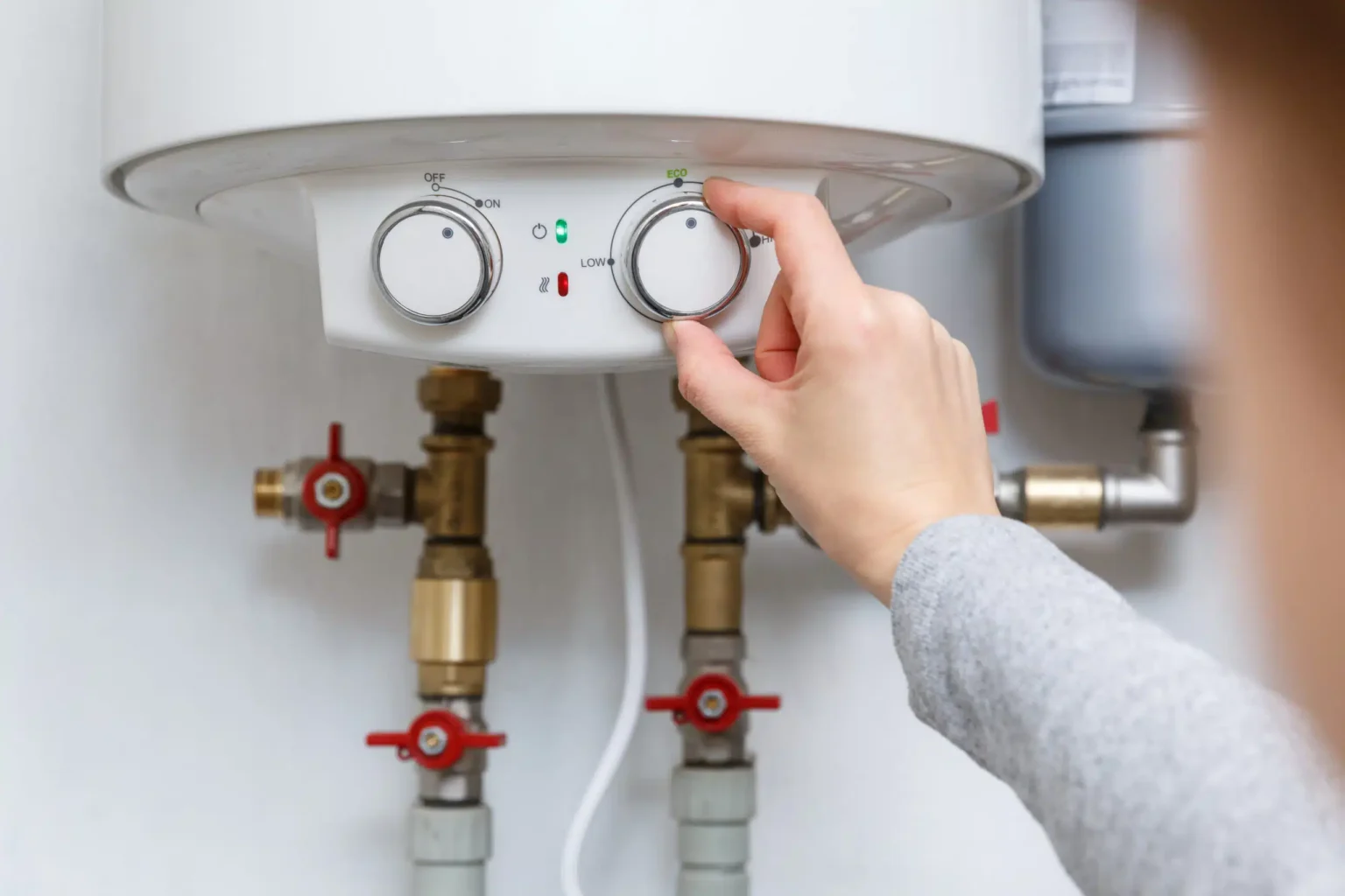 Technician adjusting a water heater in El Monte